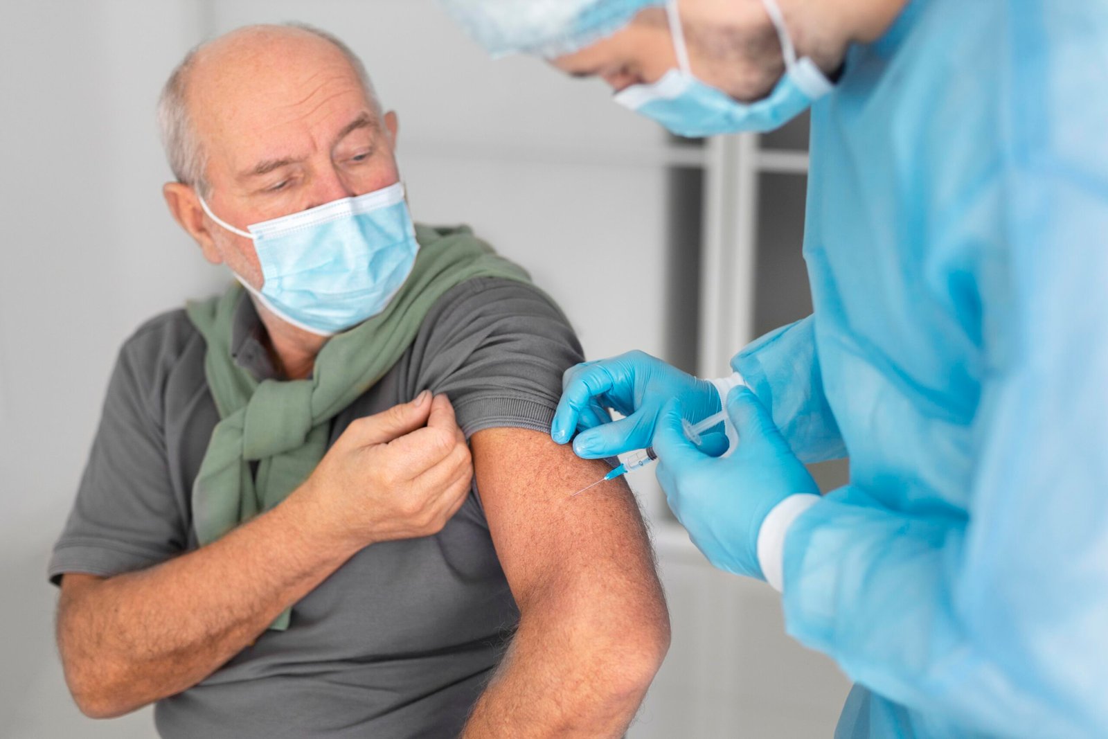 Old man Getting his Flu Vaccine